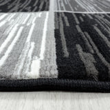 Tapis Noir Élégance en Polypropylène Royaume du Tapis