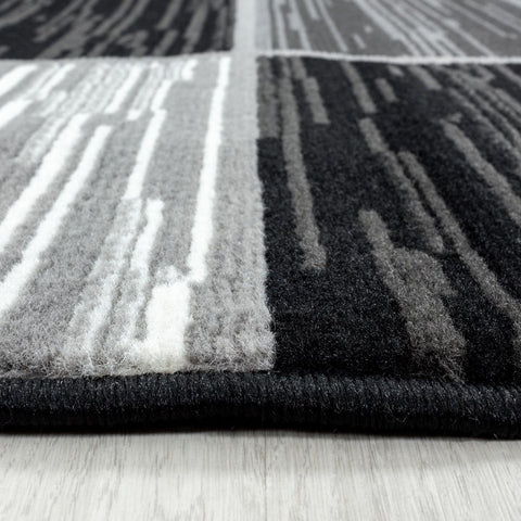 Tapis Noir Élégance en Polypropylène Royaume du Tapis